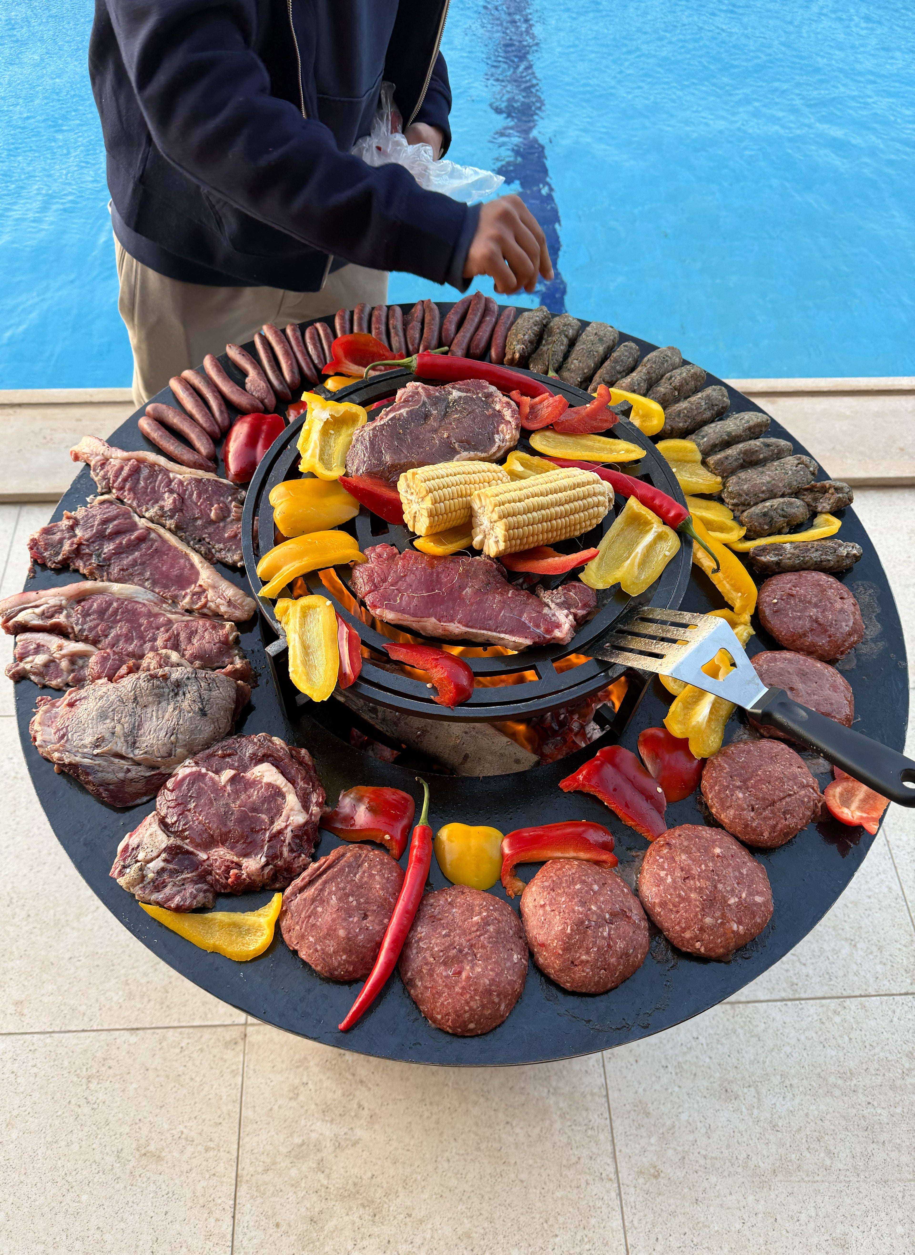 Grillit ARK 80 outdoor grill top angle showing circular cooking plate