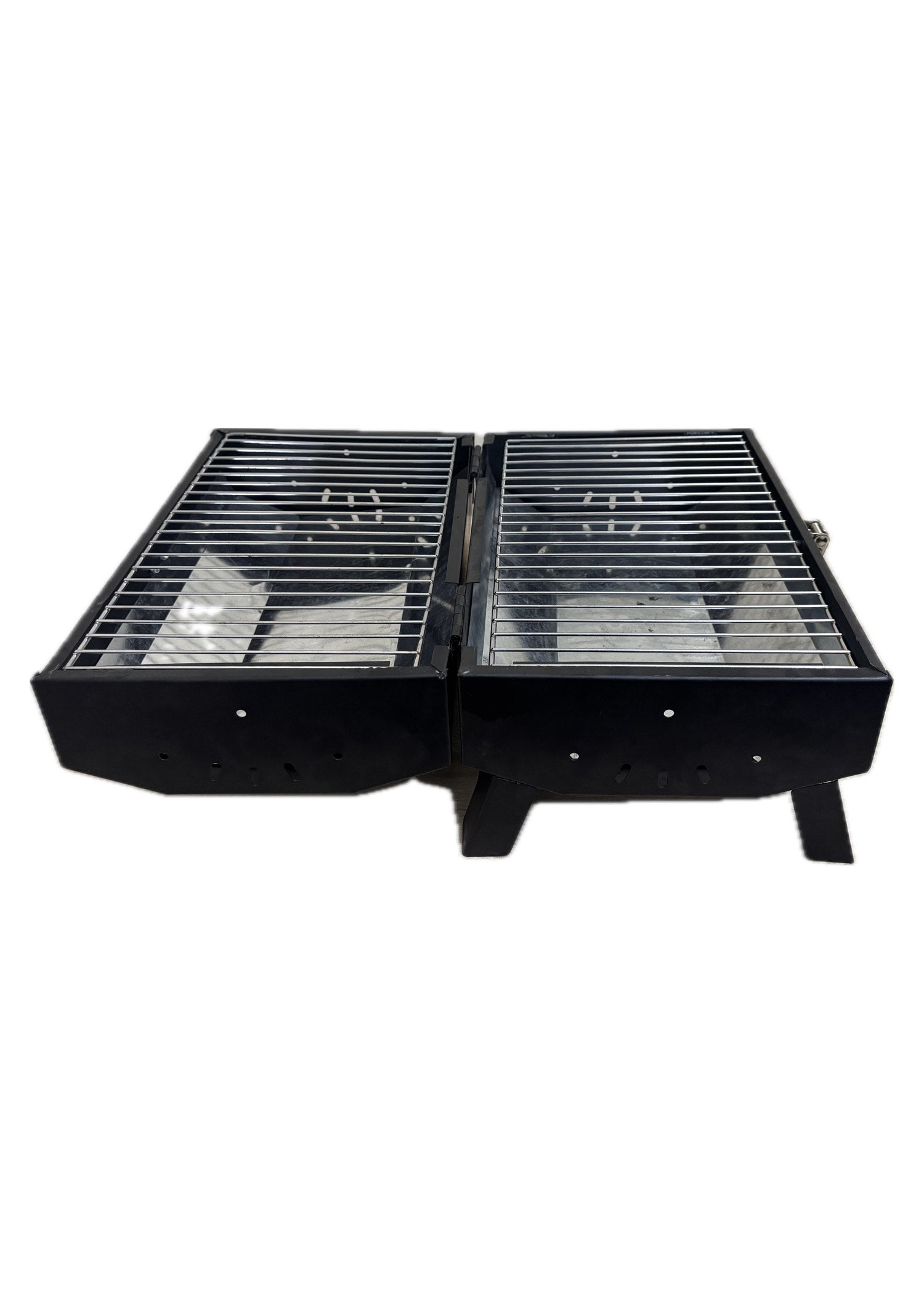 Grillit Double Barrel charcoal grill cooking meat and vegetables at the same time