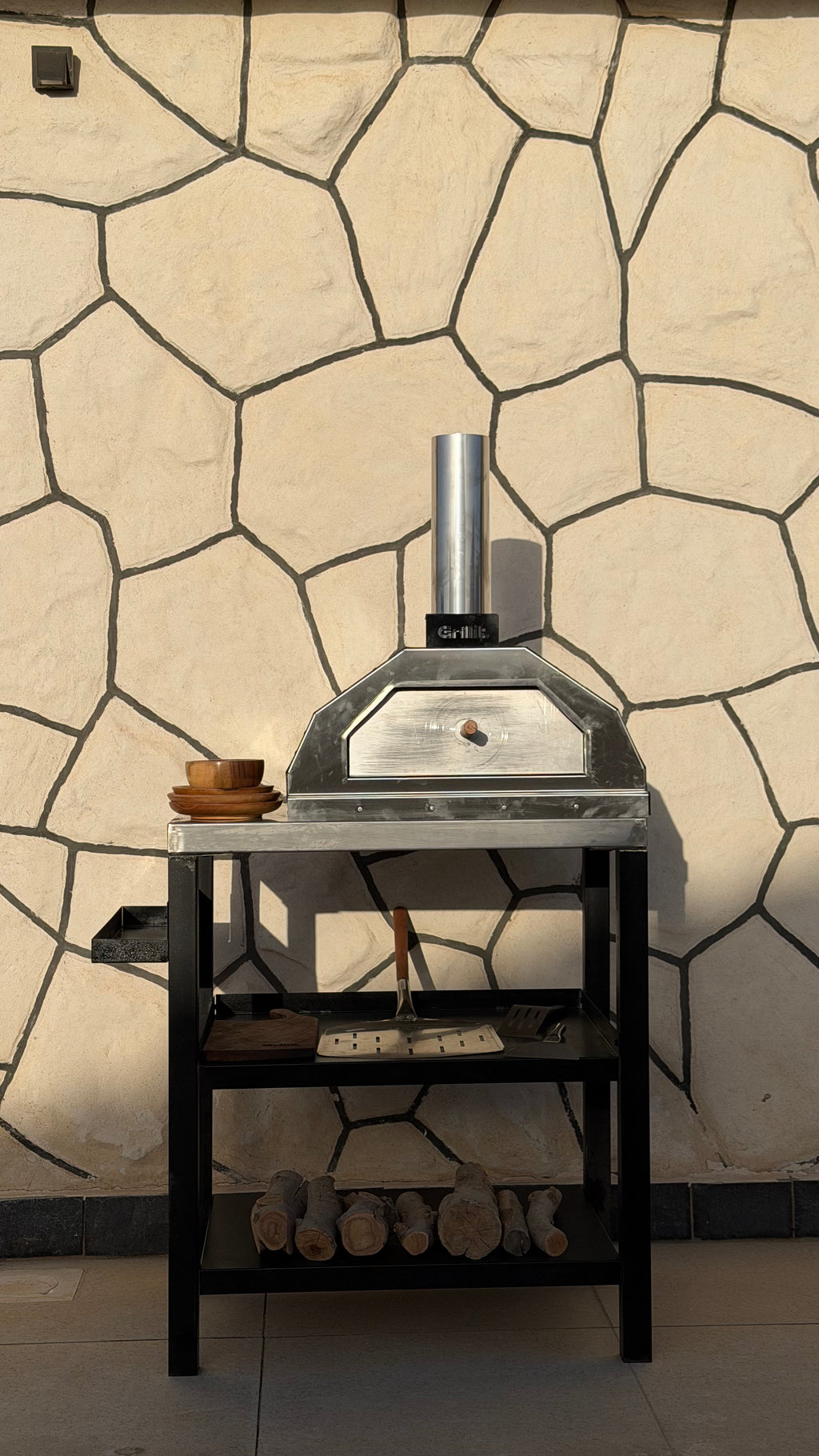 Portable wood and charcoal pizza oven for picnics and beach trips in Egypt