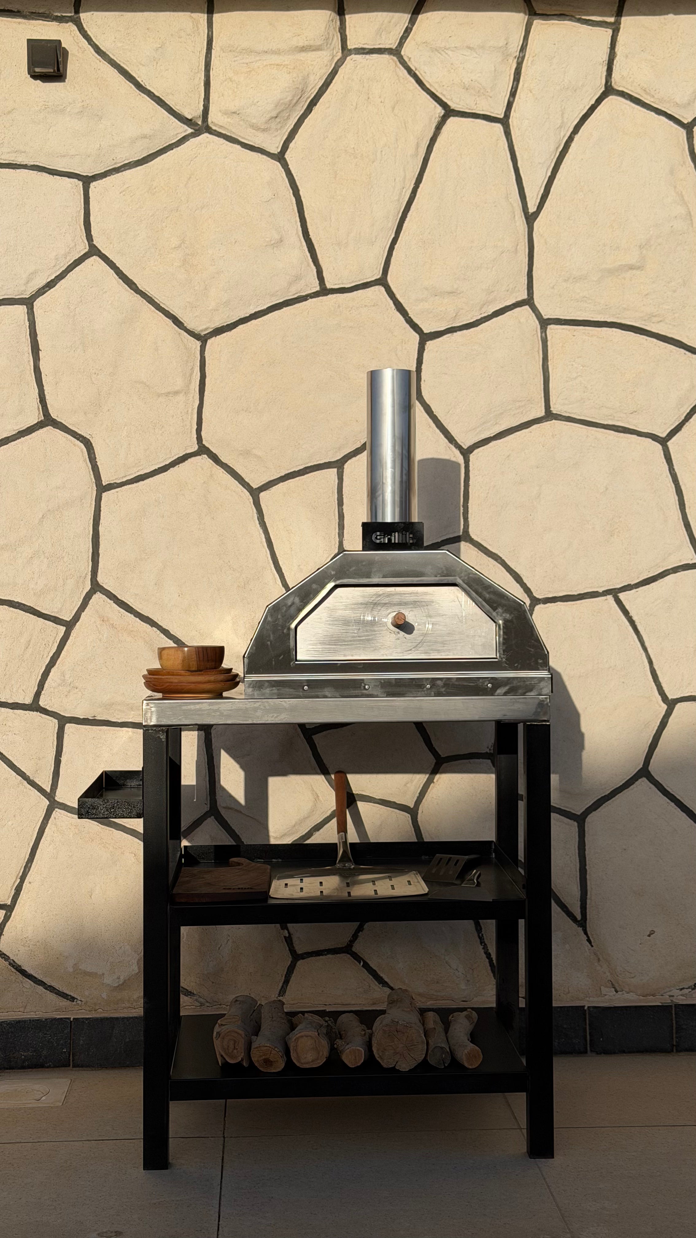 Portable wood and charcoal pizza oven for picnics and beach trips in Egypt