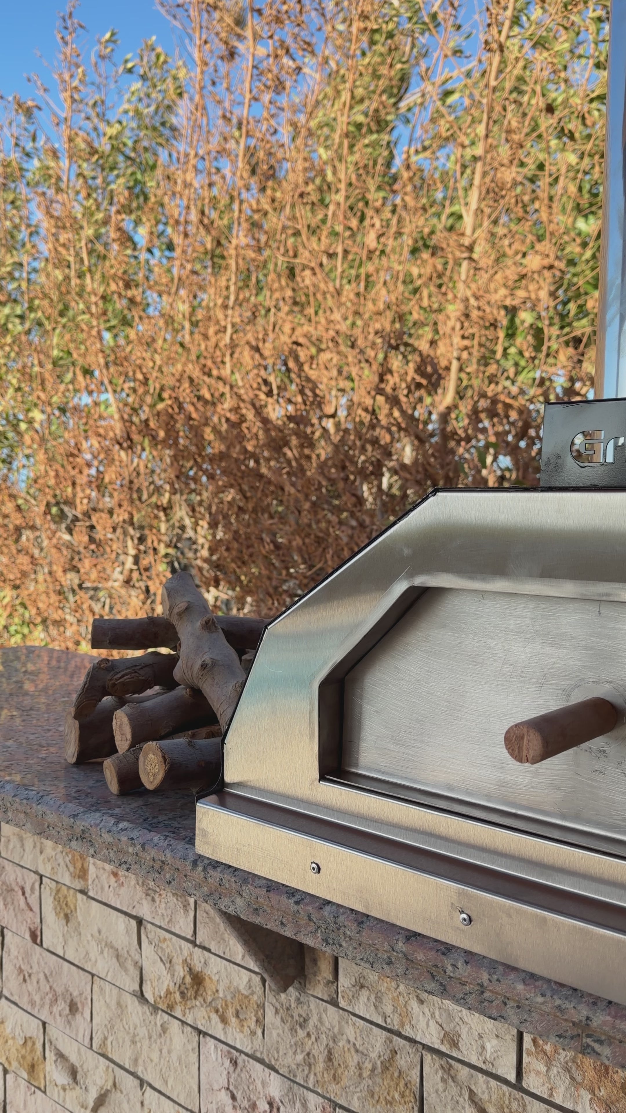 Interior view of Grillit outdoor pizza oven showing cast iron griddle and high heat performance